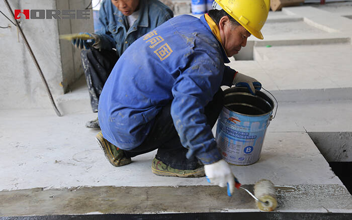 Applying carbon fiber impregnating adhesive for CFRP strengthening