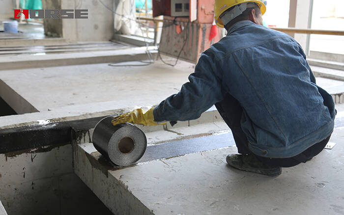 Applying carbon fiber impregnating adhesive for CFRP strengthening