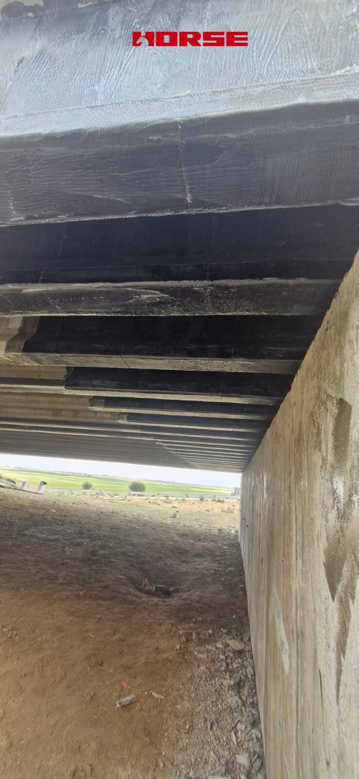 Strengthening of a Prestressed Concrete Multi-Girder Bridge with CFRP Laminate and U-warp