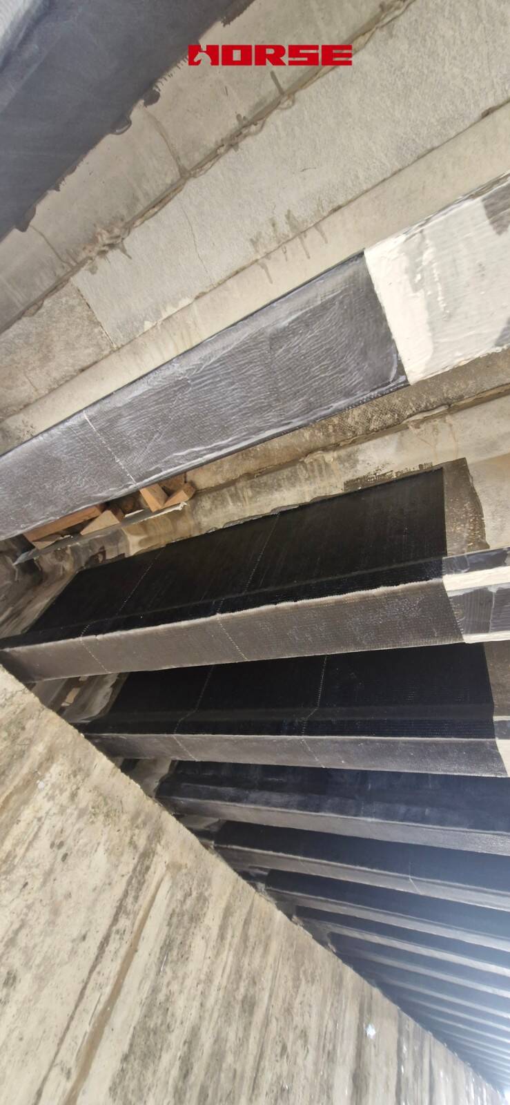 Strengthening of a Prestressed Concrete Multi-Girder Bridge with CFRP Laminate and U-warp